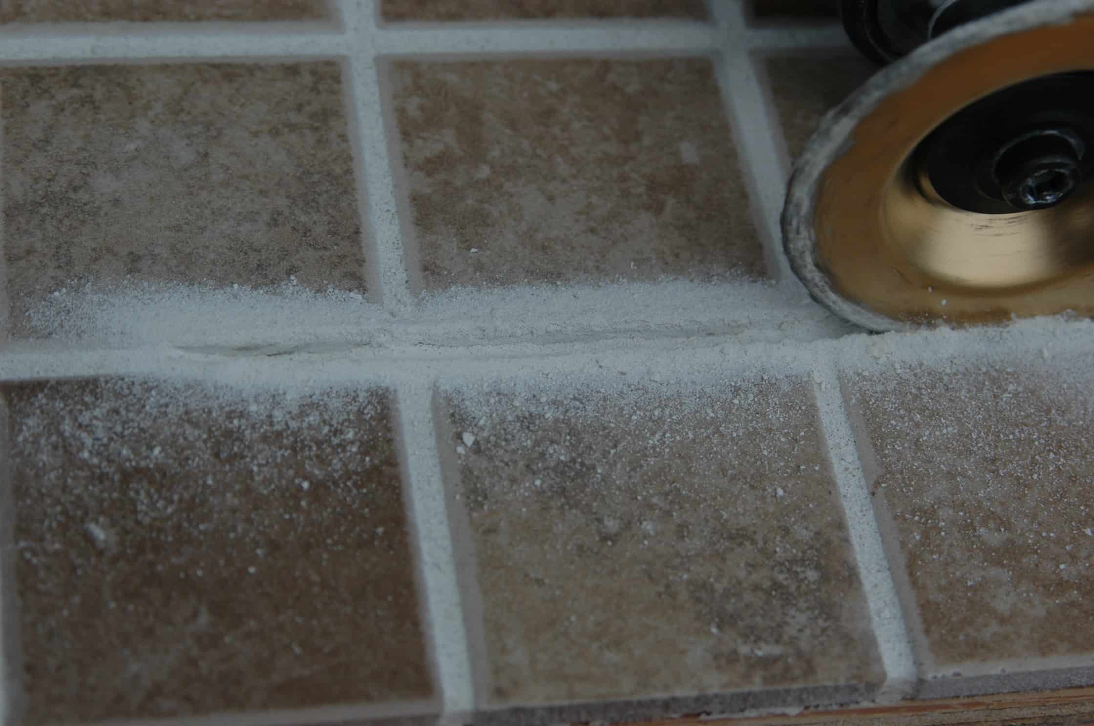 How do you repair shower grout?